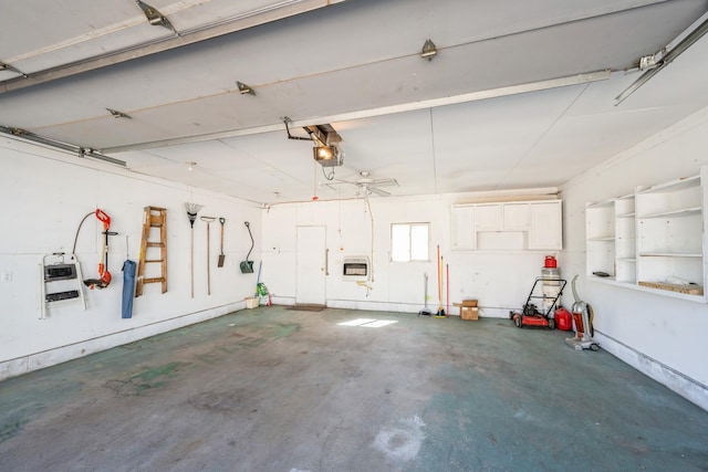 garage featuring a garage door opener and heating unit