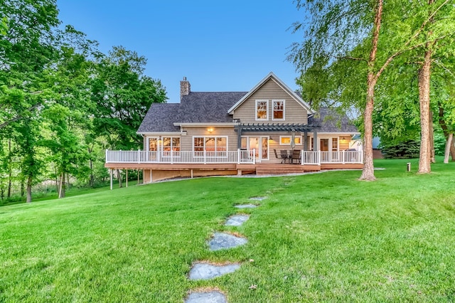 42429 Big Mcdonald Dr, Dent, MN 56528 - rear view of house with a pergola, a deck, a chimney, and a lawn