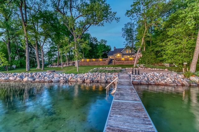 42429 Big Mcdonald Dr, Dent, MN 56528 - dock featuring a water view and a lawn