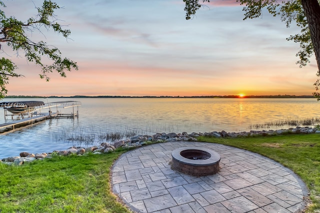 42429 Big Mcdonald Dr, Dent, MN 56528 - dock with an outdoor fire pit, a water view, a patio, and a lawn