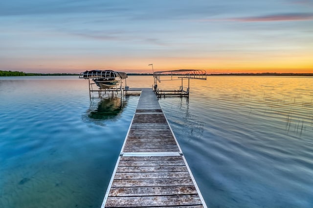 42429 Big Mcdonald Dr, Dent, MN 56528 - dock area with boat lift and a water view