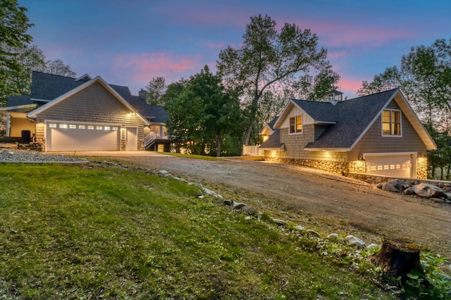 42429 Big Mcdonald Dr, Dent, MN 56528 - view of front facade featuring stone siding, driveway, a yard, and a chimney