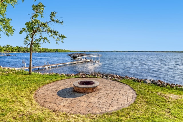 42429 Big Mcdonald Dr, Dent, MN 56528 - view of patio / terrace featuring an outdoor fire pit, a dock, and a water view