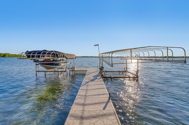 42429 Big Mcdonald Dr, Dent, MN 56528 - dock area featuring boat lift and a water view