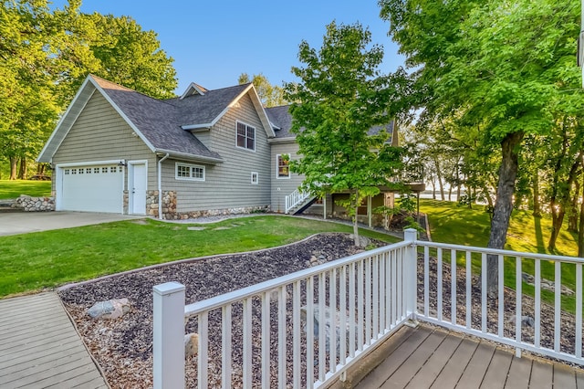 42429 Big Mcdonald Dr, Dent, MN 56528 - deck featuring a yard, stairway, driveway, and a garage