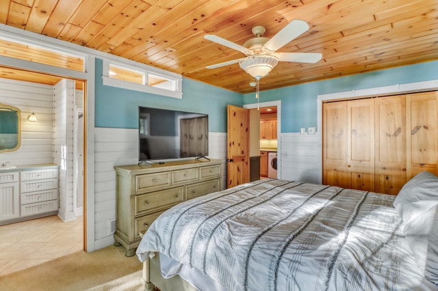 42429 Big Mcdonald Dr, Dent, MN 56528 - bedroom featuring washer / clothes dryer, wood ceiling, wood walls, a wainscoted wall, and light colored carpet