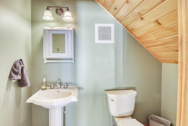 42429 Big Mcdonald Dr, Dent, MN 56528 - half bathroom featuring toilet, lofted ceiling, and wood ceiling