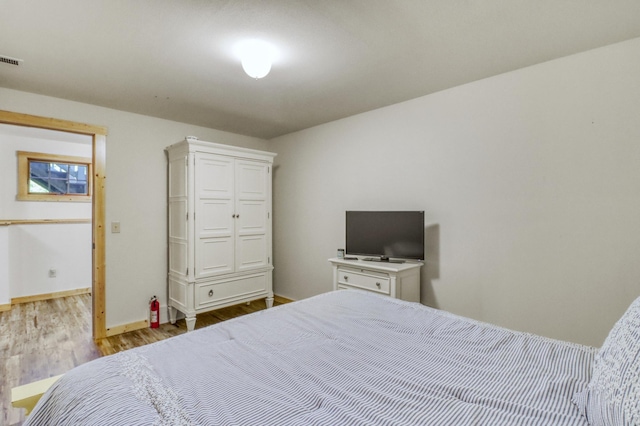 42429 Big Mcdonald Dr, Dent, MN 56528 - bedroom with wood finished floors and baseboards