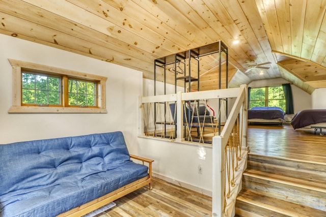 42429 Big Mcdonald Dr, Dent, MN 56528 - staircase featuring wood-type flooring, wood ceiling, lofted ceiling, a ceiling fan, and baseboards