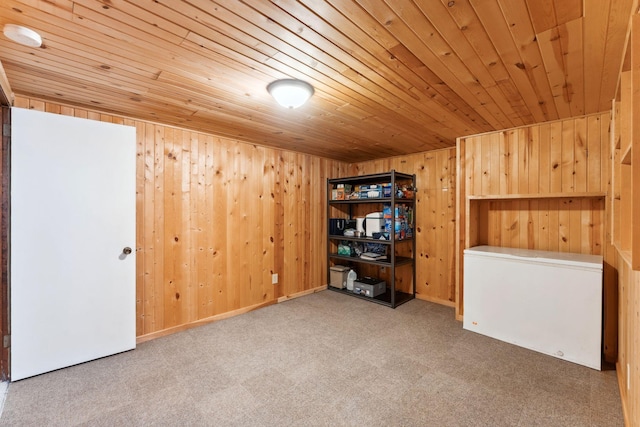 interior space featuring carpet flooring, wood walls, and wood ceiling