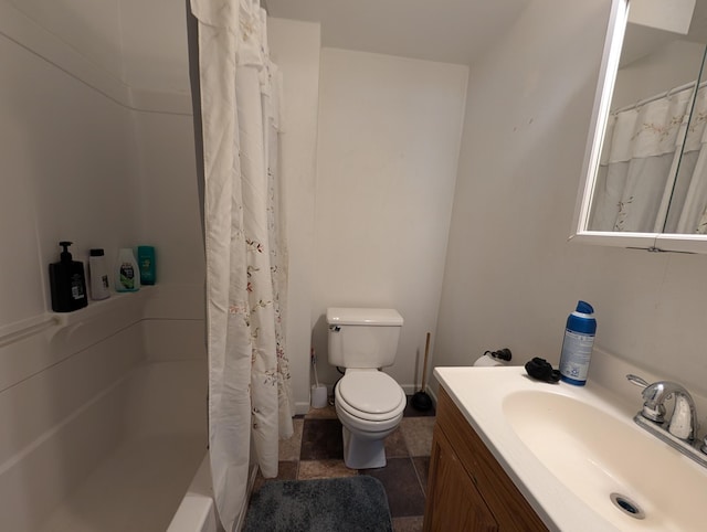 bathroom with vanity, tile patterned flooring, and toilet