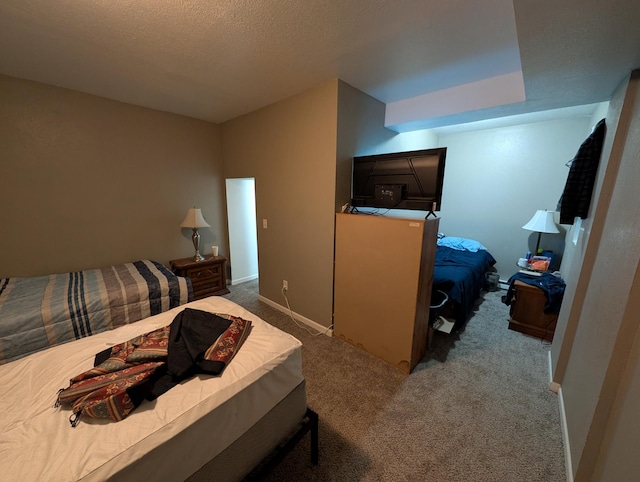 carpeted bedroom with a textured ceiling
