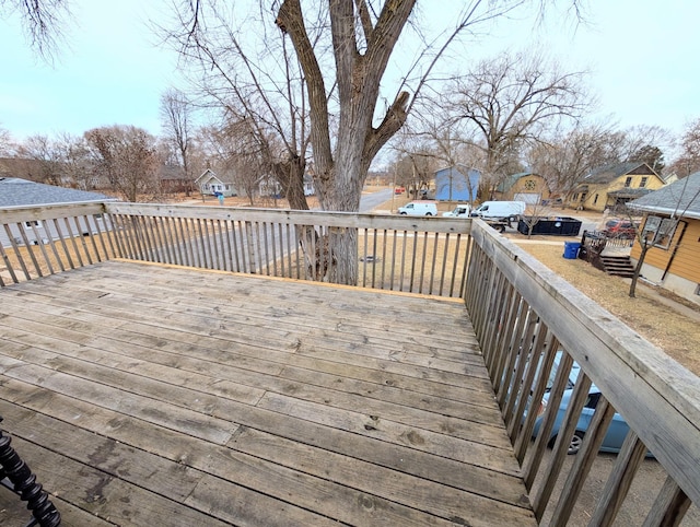 wooden deck with a residential view