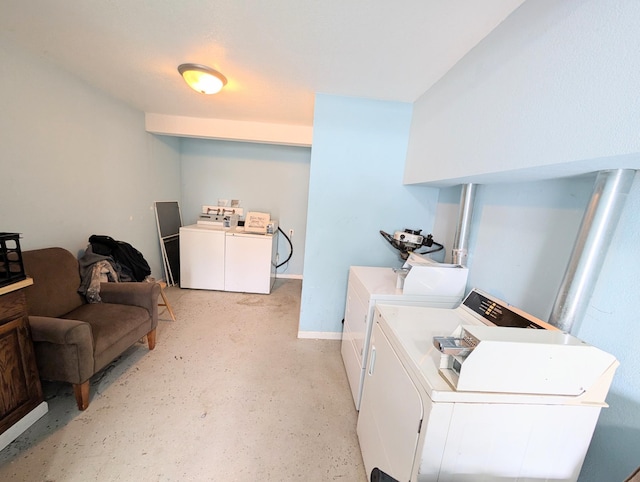 community laundry room featuring washing machine and dryer