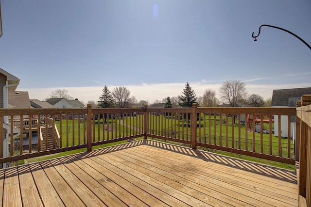 wooden terrace with a yard