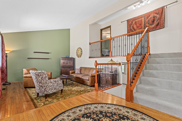 living room featuring hardwood / wood-style floors and stairs