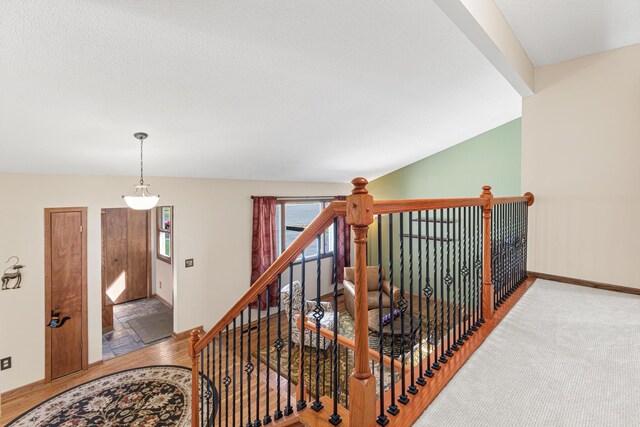 stairs featuring wood finished floors and baseboards
