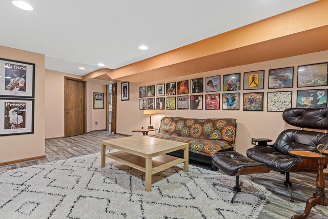 living area featuring wood finished floors, recessed lighting, and baseboards