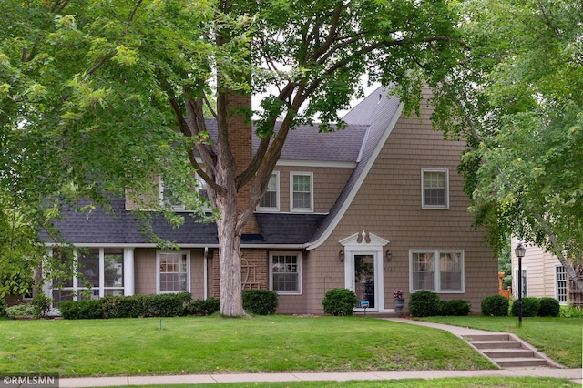 5128 Irving Ave S, Minneapolis, MN 55419 - view of front facade with a front yard, a chimney, and roof with shingles