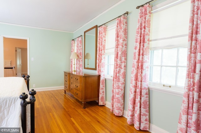 5128 Irving Ave S, Minneapolis, MN 55419 - bedroom with multiple windows, light wood-style floors, baseboards, and ornamental molding