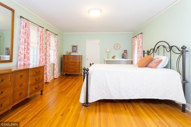 5128 Irving Ave S, Minneapolis, MN 55419 - bedroom featuring light wood-style floors, crown molding, and baseboards