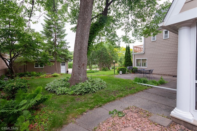 5128 Irving Ave S, Minneapolis, MN 55419 - view of grassy yard featuring a patio
