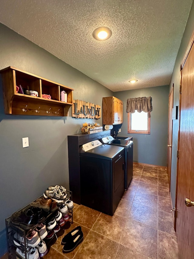 kitchen featuring recessed lighting, a textured ceiling, and washing machine and dryer