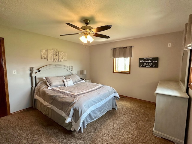 bedroom featuring carpet, a ceiling fan, and a textured ceiling