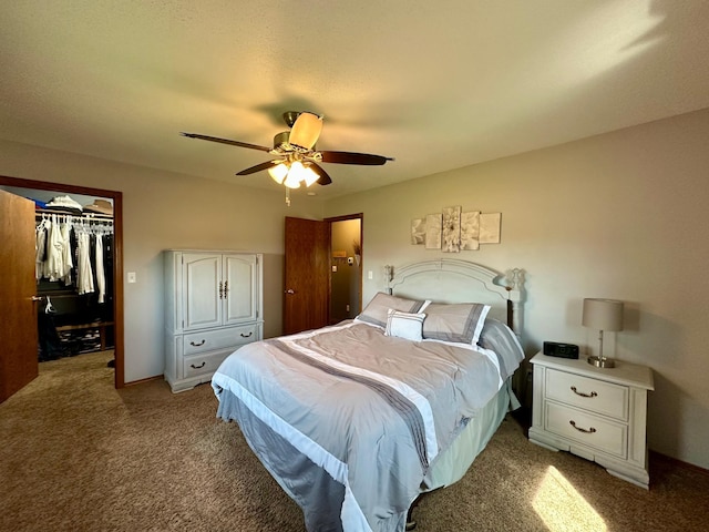 bedroom featuring ceiling fan, light colored carpet, a spacious closet, and a closet