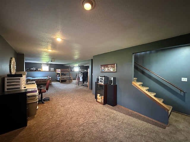 carpeted office space with a textured ceiling