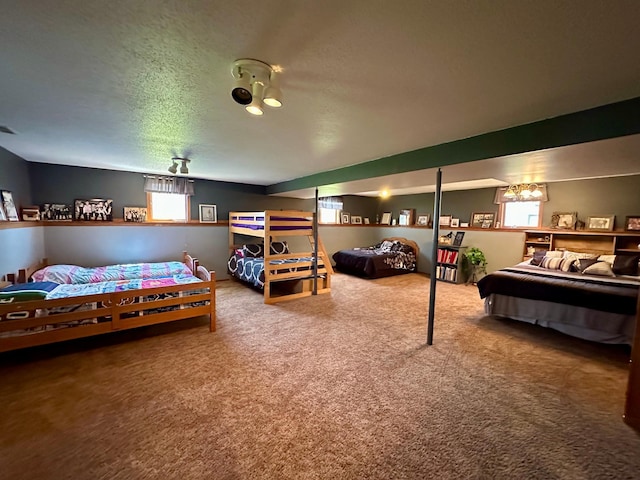 carpeted bedroom with a textured ceiling