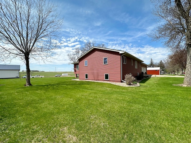 view of home's exterior featuring a lawn