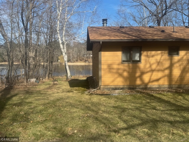 view of outbuilding with a water view