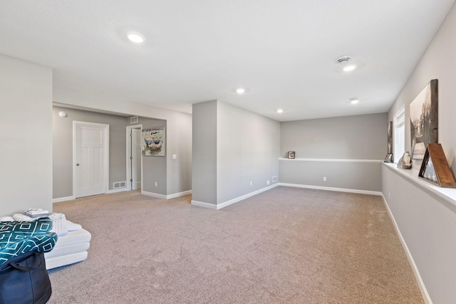 basement with carpet, baseboards, and recessed lighting