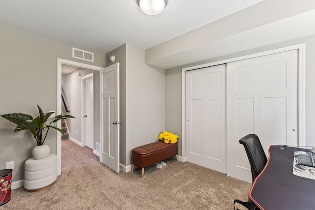 carpeted office with baseboards