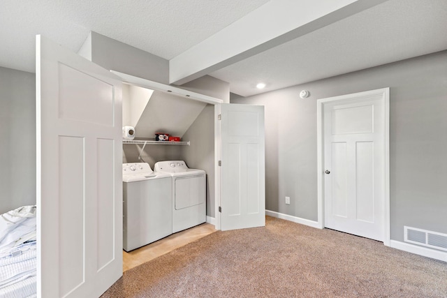 laundry area with washer and clothes dryer, carpet flooring, and baseboards