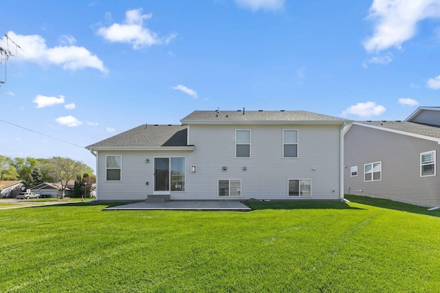 back of house with a patio and a yard