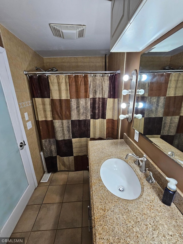 full bath with vanity, tile patterned floors, a shower with shower curtain, and visible vents