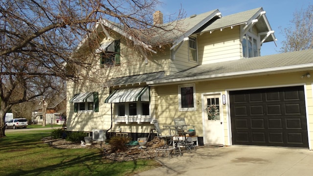 101 5th St, Cyrus, MN 56323 - view of front of property with a garage, a front lawn, a chimney, a shingled roof, and concrete driveway