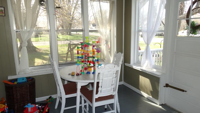101 5th St, Cyrus, MN 56323 - sunroom / solarium featuring baseboards, wood finished floors, and a wealth of natural light