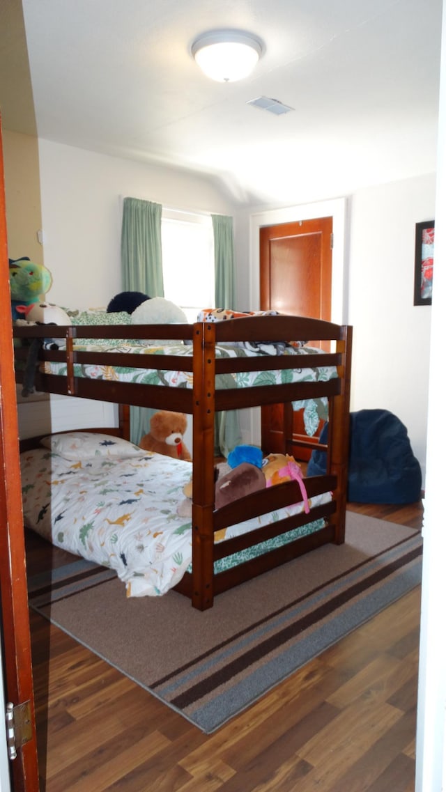 101 5th St, Cyrus, MN 56323 - bedroom featuring wood finished floors and visible vents