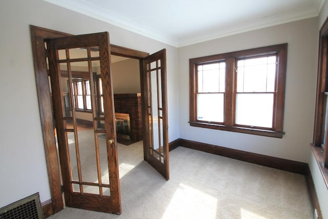 interior space featuring french doors, crown molding, carpet floors, and visible vents