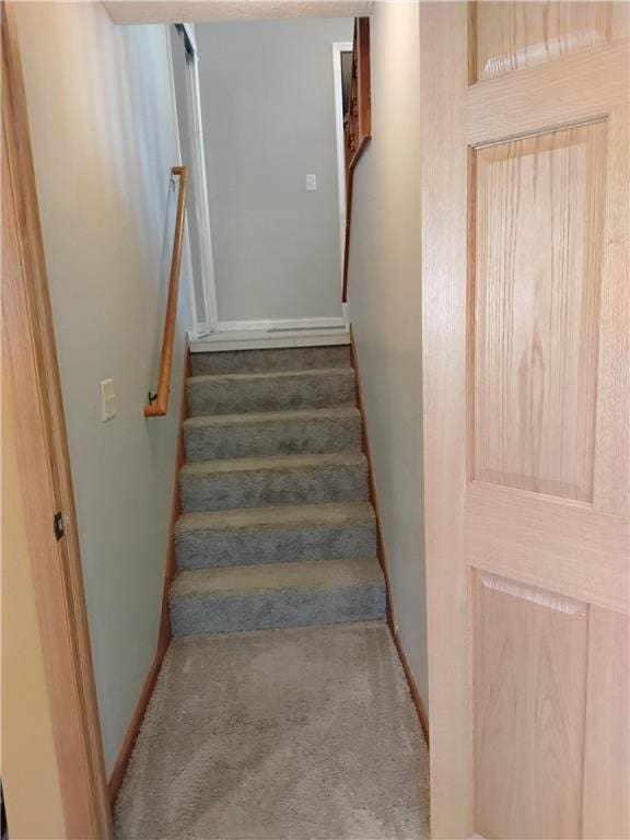 9007 Hampshire Ave N, Brooklyn Park, MN 55445 - staircase with baseboards and carpet