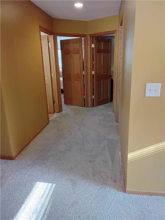 9007 Hampshire Ave N, Brooklyn Park, MN 55445 - hallway featuring carpet flooring and baseboards