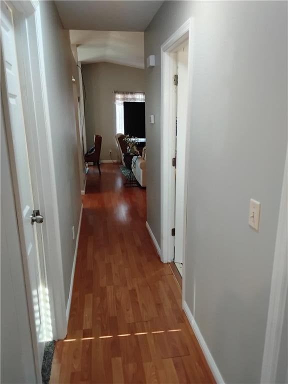 9007 Hampshire Ave N, Brooklyn Park, MN 55445 - corridor featuring baseboards and wood finished floors