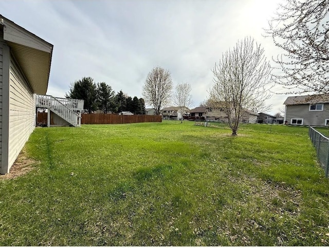 9007 Hampshire Ave N, Brooklyn Park, MN 55445 - view of yard with stairway and fence