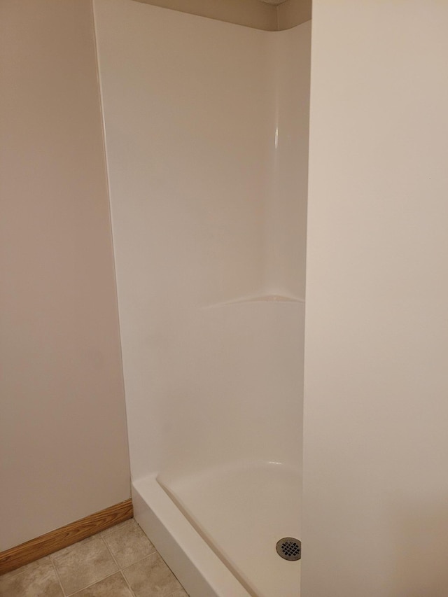 44 Willow Way, Farmington, MN 55024 - full bath with a shower stall, baseboards, and tile patterned flooring