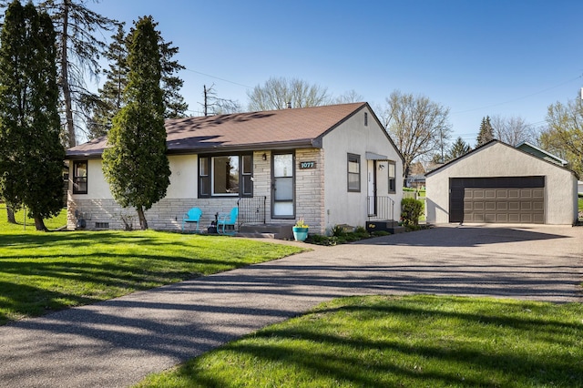 view of front of home with stone siding, a detached garage, stucco siding, a front yard, and an outbuilding