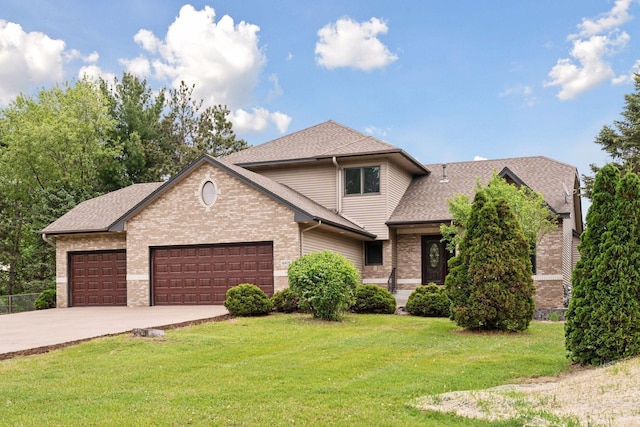 16439 Tippecanoe St NE, Ham Lake, MN 55304 - view of front of home featuring an attached garage, brick siding, a shingled roof, and driveway