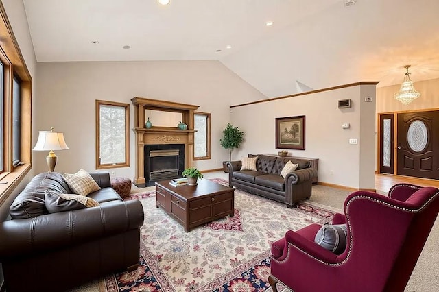 16439 Tippecanoe St NE, Ham Lake, MN 55304 - living area with vaulted ceiling, baseboards, light carpet, a fireplace with flush hearth, and recessed lighting